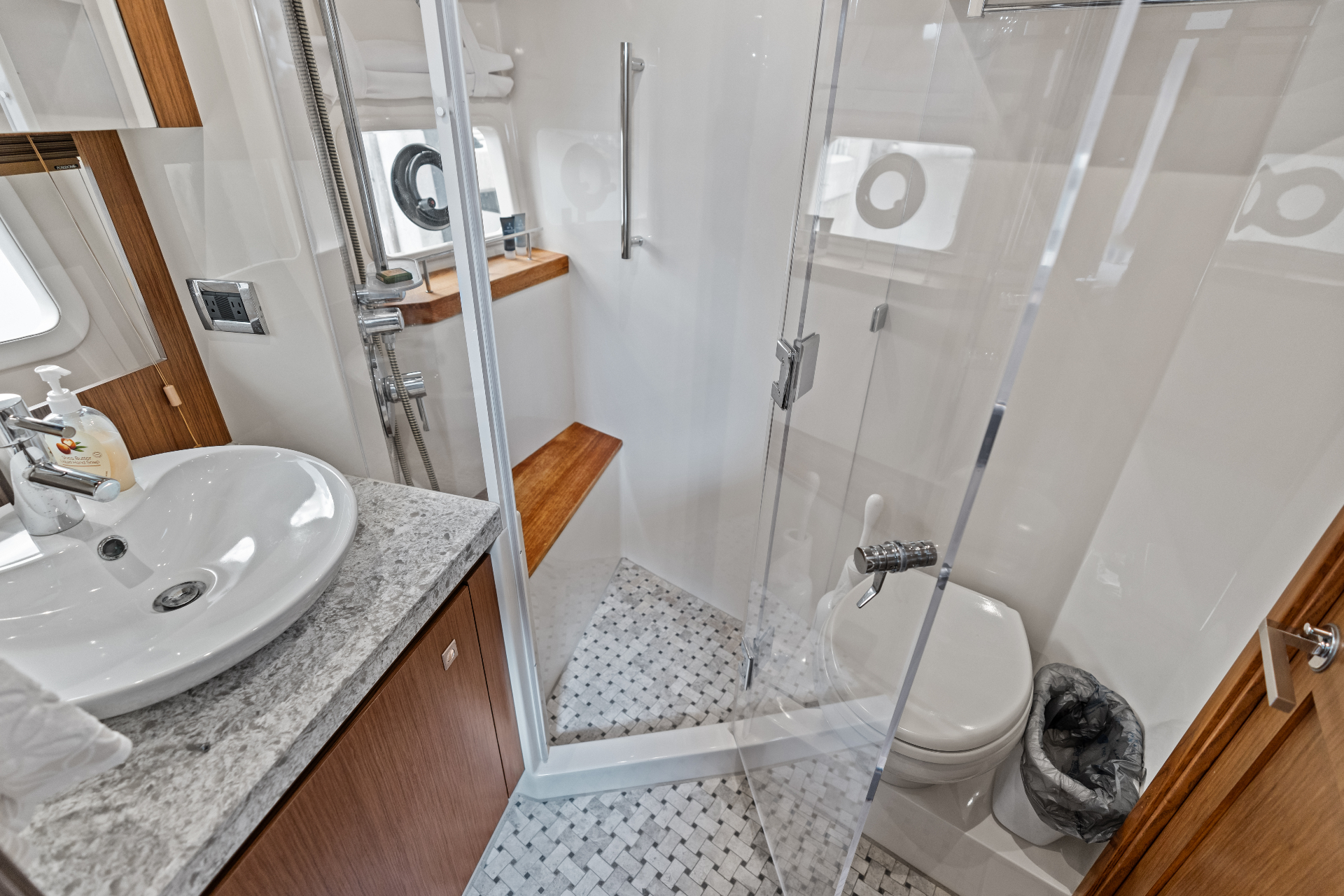 Head with glass shower enclosure